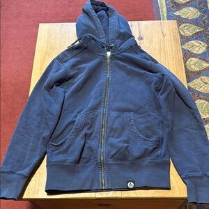 American Giant zip up hoodie in blue size small.